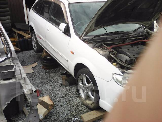 крыло на mazda familia