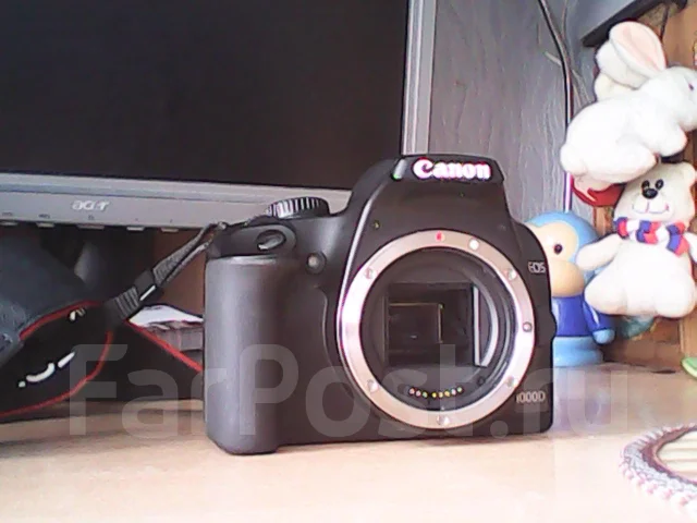 Canon EOS 1000D body. 10 - 14.9 �� ����