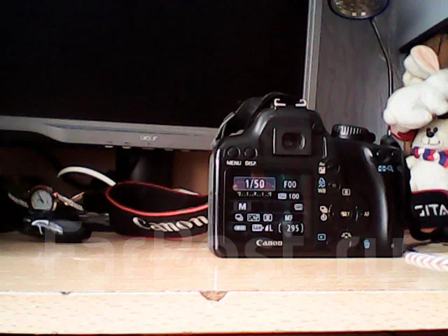 Canon EOS 1000D body. 10 - 14.9 �� ����