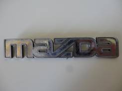 Эмблема. Mazda
