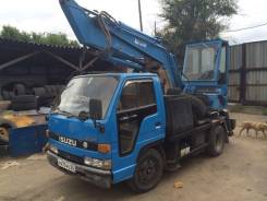 Isuzu Elf. Автоэкскаватор, 3 600 куб. см., 0,25 куб. м.