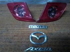 Эмблема. Mazda Axela