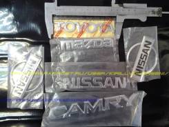 Эмблема. Mazda