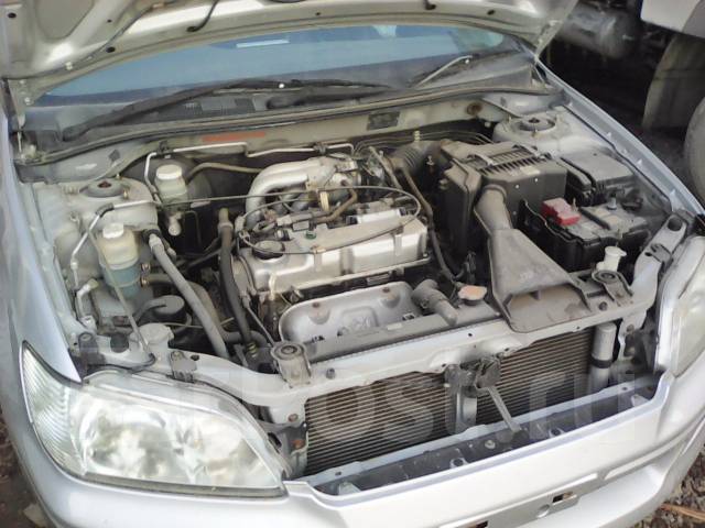 где находится номер двигателя mitsubishi lancer 9