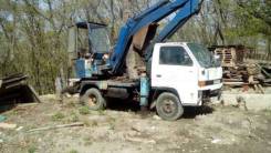 Isuzu Elf. Эксковатор Isuzu ELF 1989., 3 300 куб. см., 0,25 куб. м.