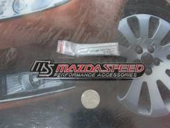 Эмблема решетки. Mazda