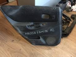 Обшивка двери Mazda Familia S-Wagon, левая задняя
