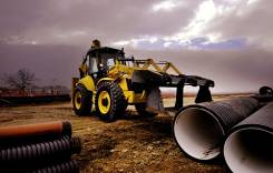 New Holland B115B. Экскаватор-погрузчик , 100 куб. см., 0,22 куб. м.