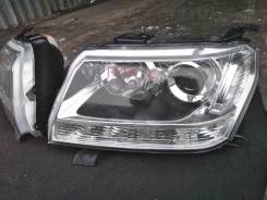 Фара. Suzuki Grand Vitara Suzuki Escudo, TDA4W Двигатель J24B