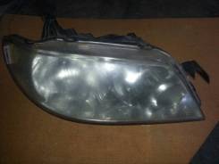Фара. Mazda Familia, BJ5P, BJFW, BJFP, BJEP, BJ5W, BJ3P, BJ8W Двигатели: B3ME, FP, FPDE, ZLDE, B3, FSZE, ZL, RF, ZLVE