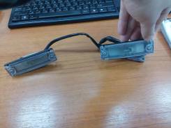 Подсветка номерной таблички в сборе оригинал Toyota 81270-35090