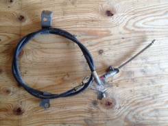 Тросик ручного тормоза. Toyota Platz, NCP12, SCP11 Toyota Vitz, NCP10, NCP13, SCP10 Двигатели: 1NZFE, 1SZFE, 2NZFE