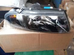 Фара. Mitsubishi Carisma, DA1A, DA2A, DA5A, DA6A Двигатели: 4G13, 4G92, 4G93, F9Q