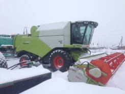 Claas. Зерноуборочный комбайн Tucano 450