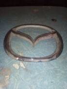 Эмблема. Mazda Demio