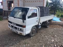 Isuzu Elf. 1990, 3 600 куб. см., 2 000 кг.