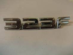 Эмблема на крышку багажника (логотип 323-F) BJ3D51720 Mazda 323 (BJ), передняя