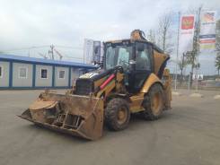 Caterpillar 428E. экскаватор-погрузчик, 1 000 куб. см., 1,00 куб. м.