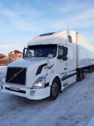 Volvo VNL 670. в сцепке, 15 000 куб. см., 40 000 кг., 6x4