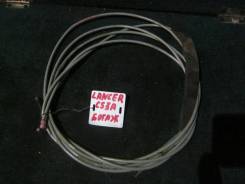 Тросик багажника. Mitsubishi Lancer, CS1A, CS3A, CS3W, CS6A, CS7A, CS7W, CS9A, CS9W Двигатели: 4G13, 4G18, 4G63, 4G69, 4G94
