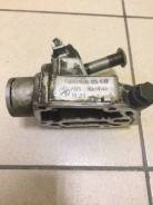 Крепление масляного фильтра. Audi A4, 8EC, 8ED, 8H7, 8HE, 8K2, 8K5, B7 Двигатели: ALT, ALZ, AUK, BBJ, BDG, BFB, BGB, BKN, BLB, BPG, BRE, BWE, BWT, CAB...