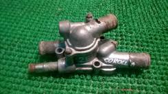 Корпус термостата. Toyota: Corsa, Corona, Corolla II, Corolla, Tercel, Raum, Sprinter, Carina, Sera, Caldina, Paseo, Cynos, Starlet Двигатели: 2E, 3E...