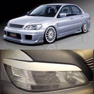 Накладка на фару. Mitsubishi Lancer Cedia Mitsubishi Lancer, CB4A, CB8A, CB4W, CB6A, CB1A, CD4W Двигатели: 4G92, 6A10, 4G13