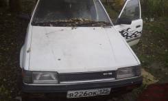 Mazda Familia. механика, передний, бензин