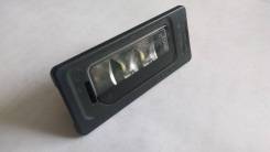Фонарь освещения номерного знака. Volkswagen: Passat, Caddy, Touareg, Transporter, Jetta, Ameo, Sharan, Tiguan, Touran, Golf, Polo Skoda: Superb, Fabi...