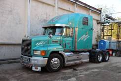 Mack. , 13 700 куб. см., 30 000 кг., 6x4