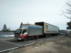 Isuzu Elf. Будка 18 куб. м. 3т. Isuzu elf, 4 300 куб. см., 3 000 кг., 4x2