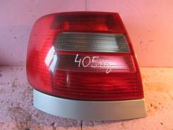 Фонарь задний левый ( красно-белый, из Германии, с планкой, серебристый) Audi