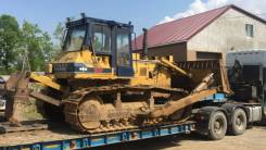 Komatsu D65P. -11, 11 000 куб. см., 23 000 кг.