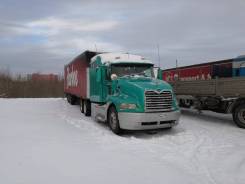 Mack. Сцепка тягач CX612 и полуприцеп Шмитц S01, 15 000 куб. см., 24 800 кг.