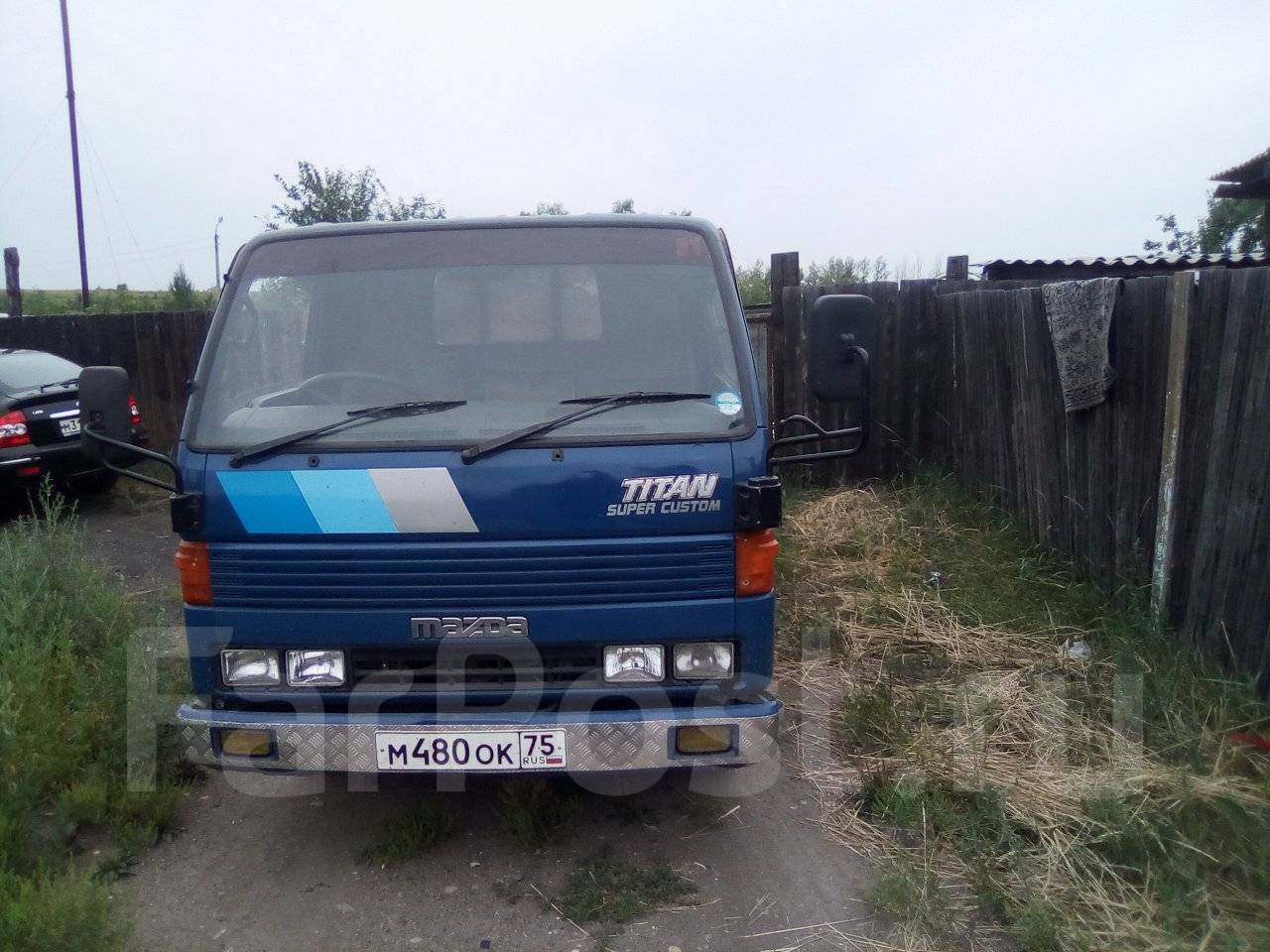 Продажа грузовиков чита. Мазда Титан 1990. Mazda Titan 7131. Мазда Титан 1998 бортовой грузовик синий. Мазда Титан 1998 года 2 тонник бортовой.