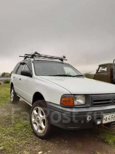 Mazda Familia. ��������, 4wd, 1.5 (105��.�.), ������, 250 000����. �� ����