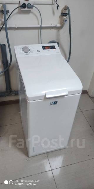 Стиральная машина с вертикальной загрузкой Electrolux EWT 1266 EEW