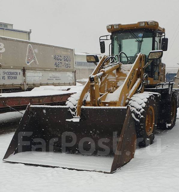 Услуги по уборке снега фронтальным погрузчиком во Владивостоке