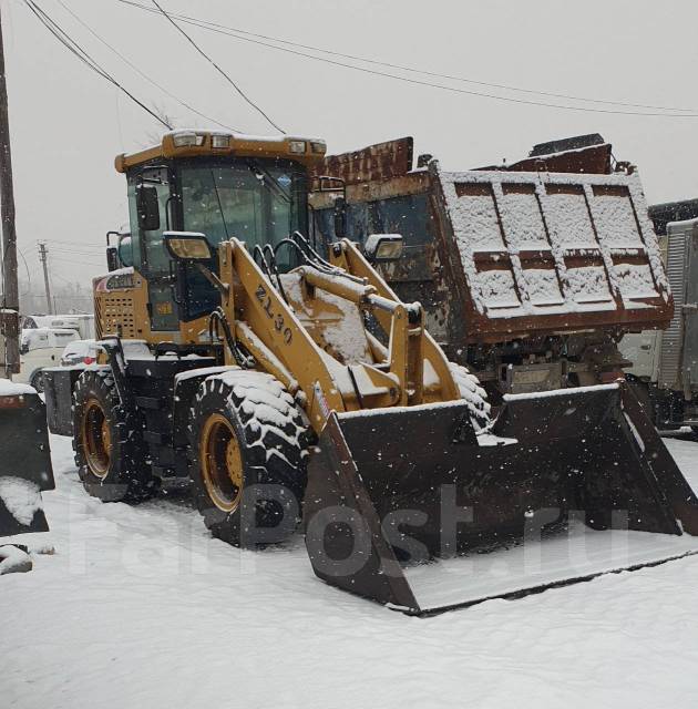 Услуги по уборке снега фронтальным погрузчиком во Владивостоке