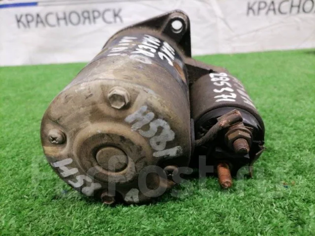 Где находится стартер на митсубиси паджеро мини