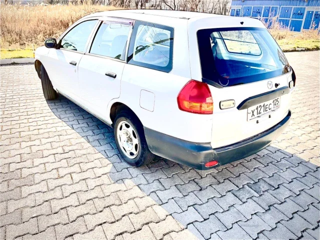 Mazda Familia. �������, 4wd, 1.8 (120��.�.), ������, 184 700����. �� ����