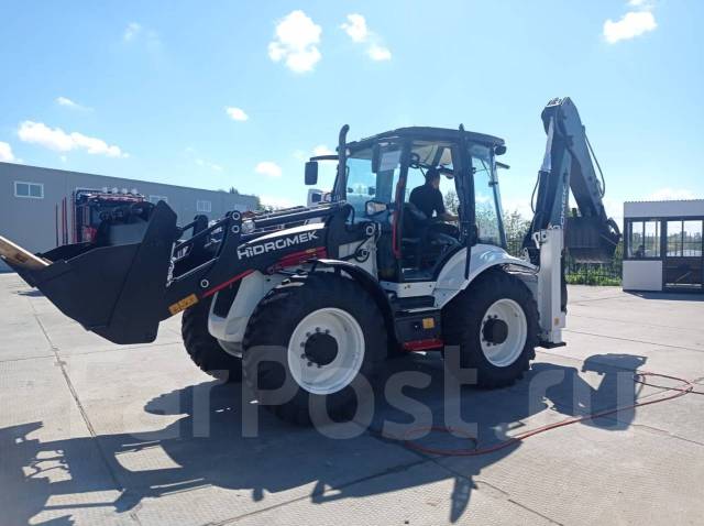 Услуги экскаватора погрузчика в Хабаровске