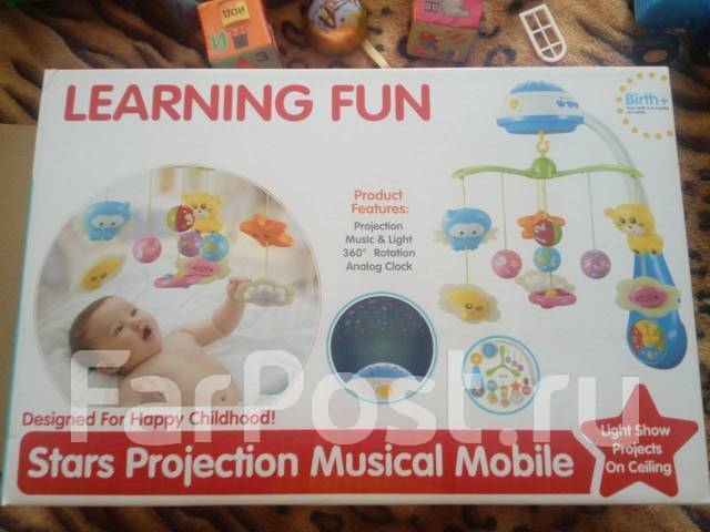   stars projection musical mobile. 