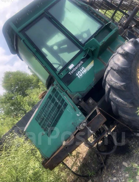John Deere. 1010 ����